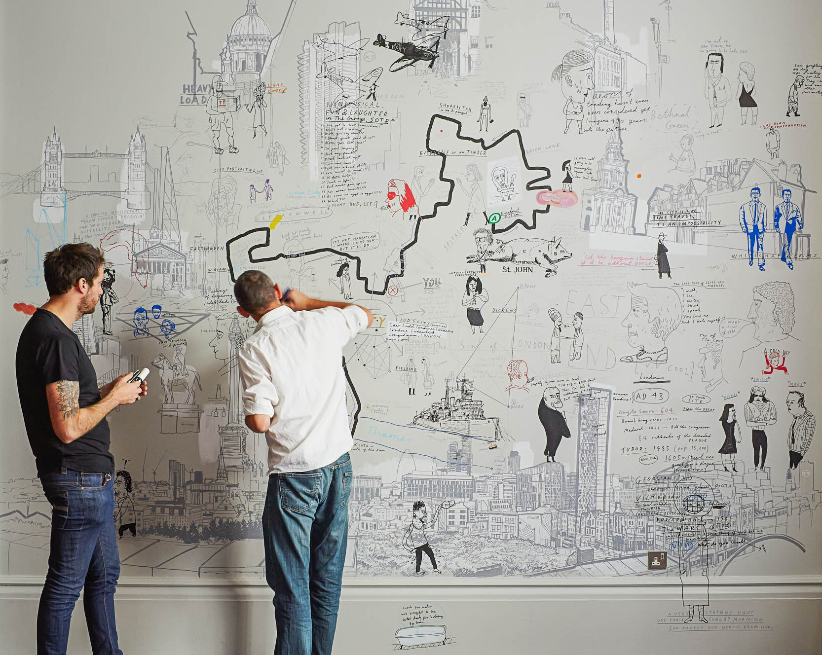 Patrick Vale and Paul Davis working on their mural, One Day Walk